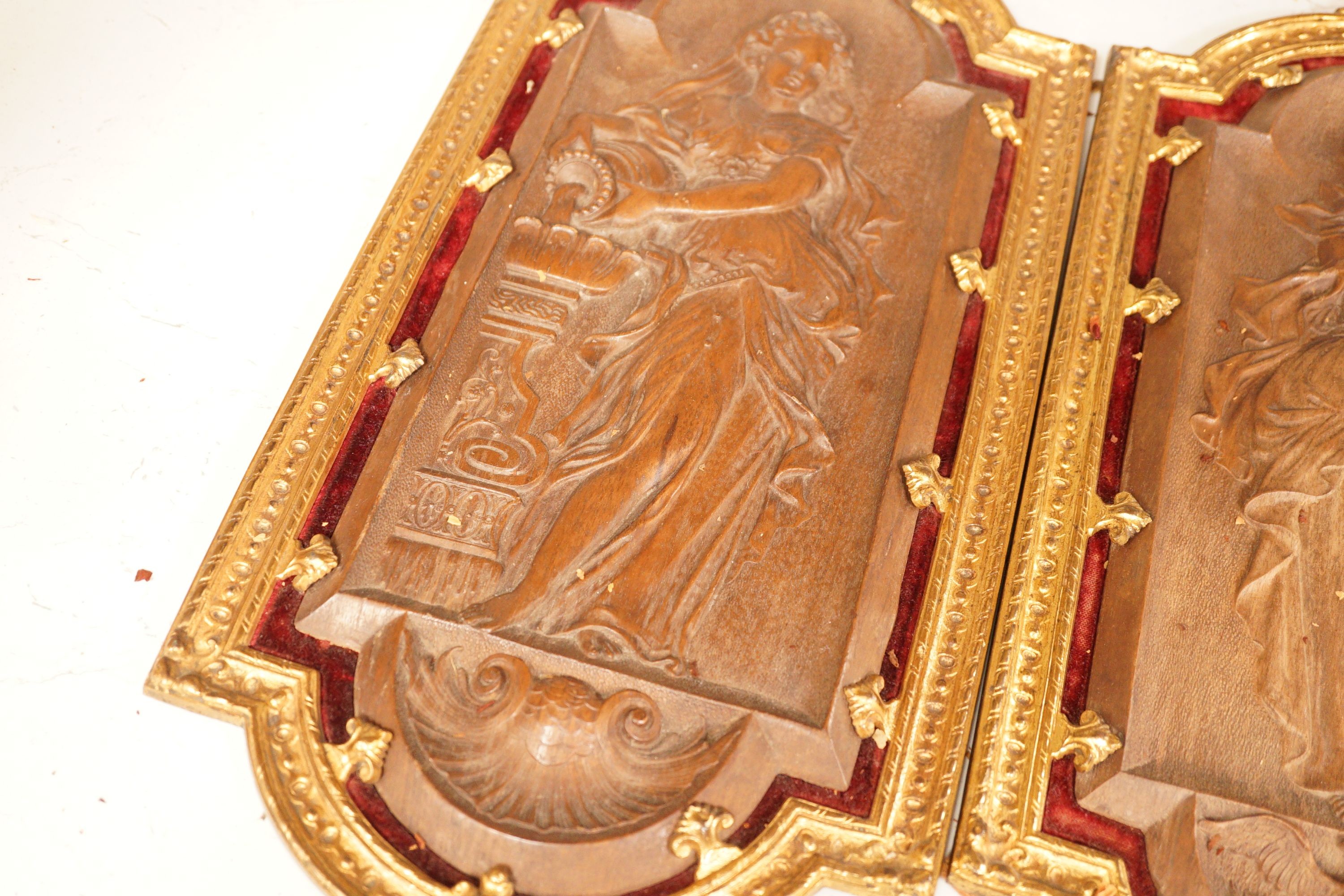 A pair of 19th century French ormolu mounted bois durci plaques, 50cm